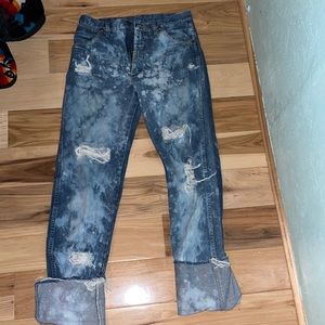 Distressed/bleached wrangler jeans.